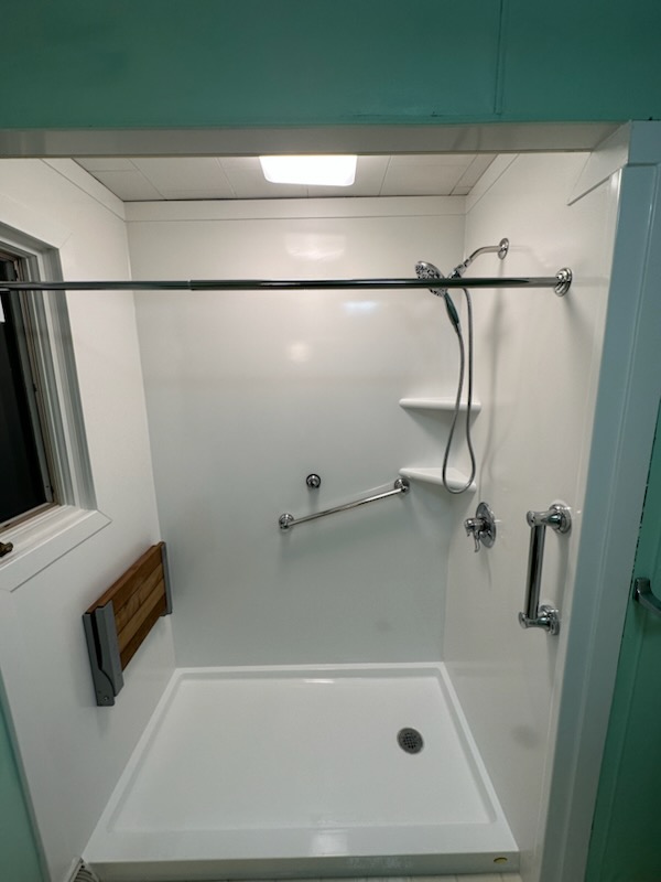 Bathroom conversion projects from Just Bath include replacing an old bathtub with an accessible shower. 